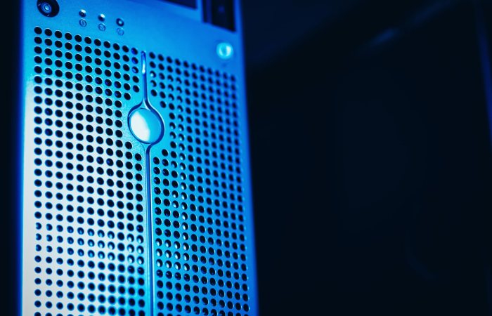 Modern server rack with blue lighting in a secure data center environment.