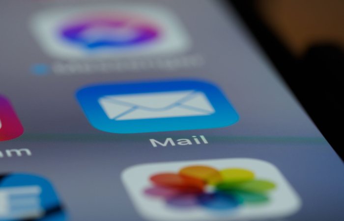 Detailed close-up of an email app icon on a smartphone screen, showcasing modern technology.