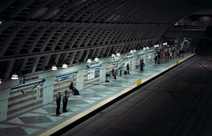 Seattle subway station platform with people waiting at night